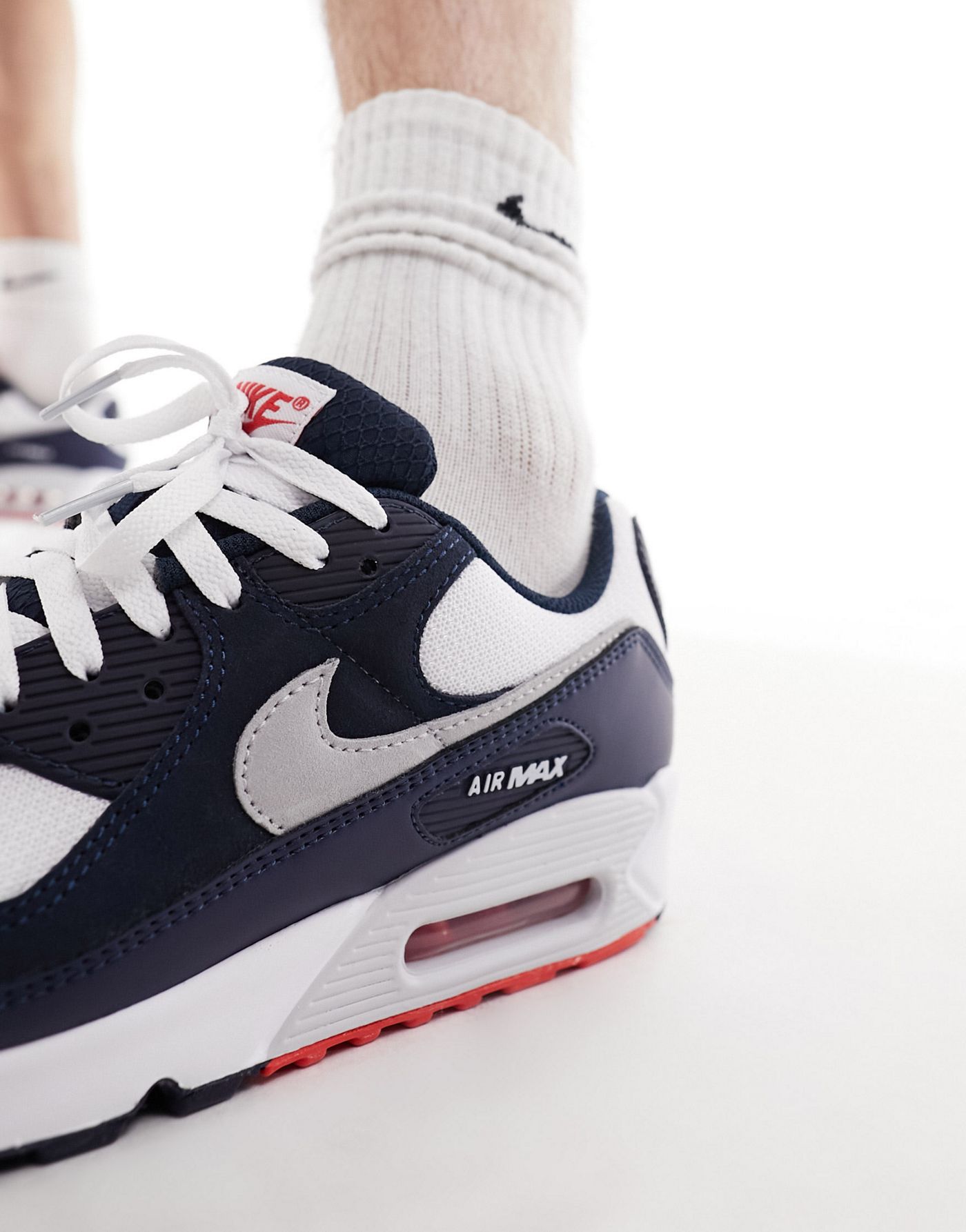 Nike Air Max 90 trainers in navy, white and red