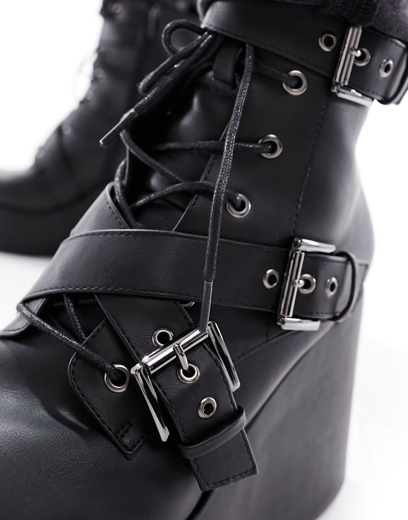 ASOS DESIGN wedge heeled boots in black faux leather with buckle detail