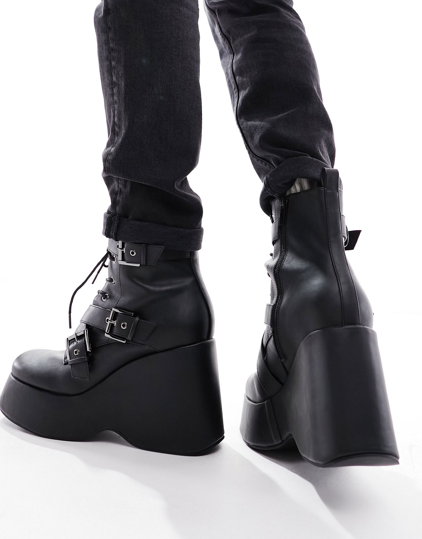 ASOS DESIGN wedge heeled boots in black faux leather with buckle detail