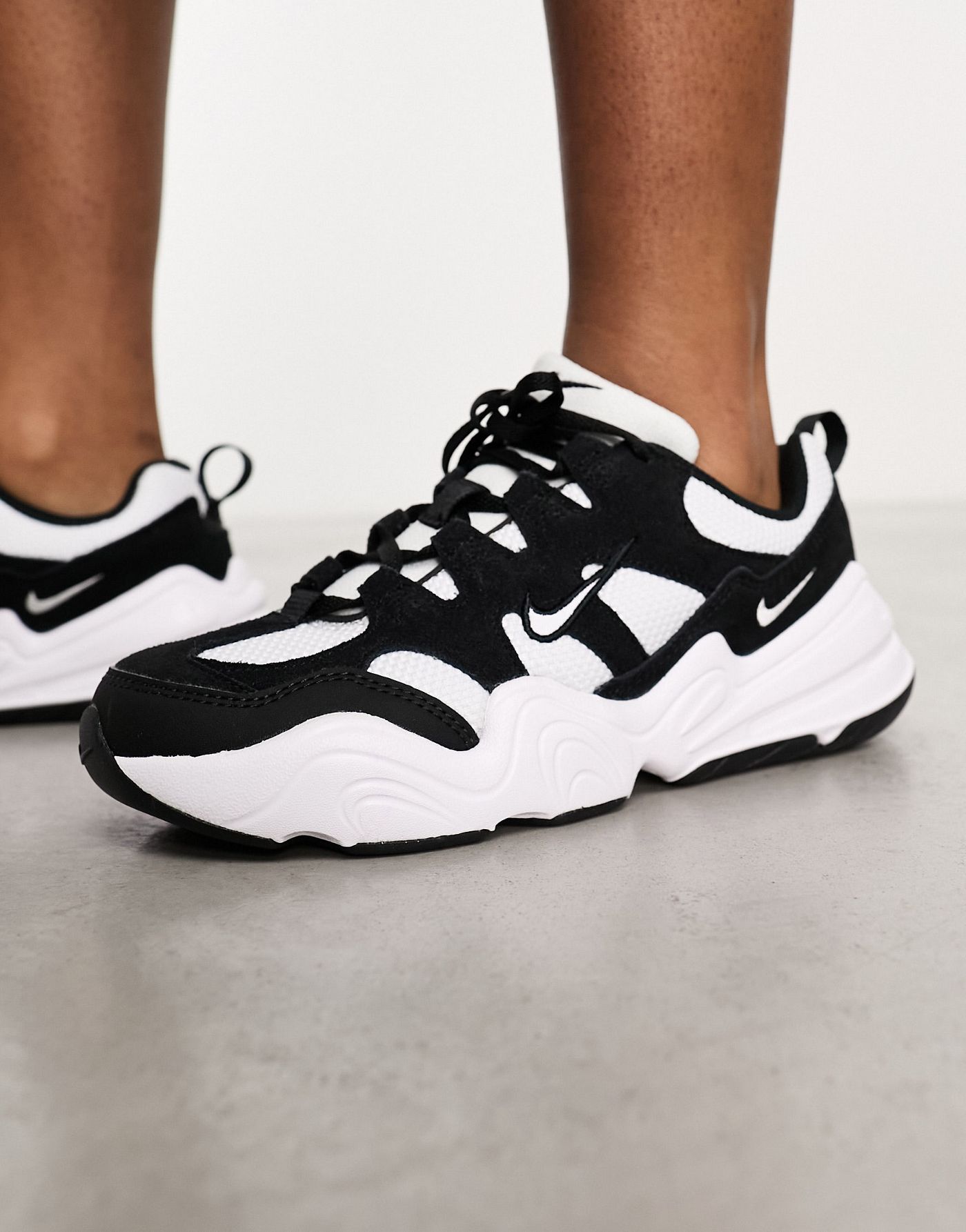 Nike Tech Hera trainers in white and black