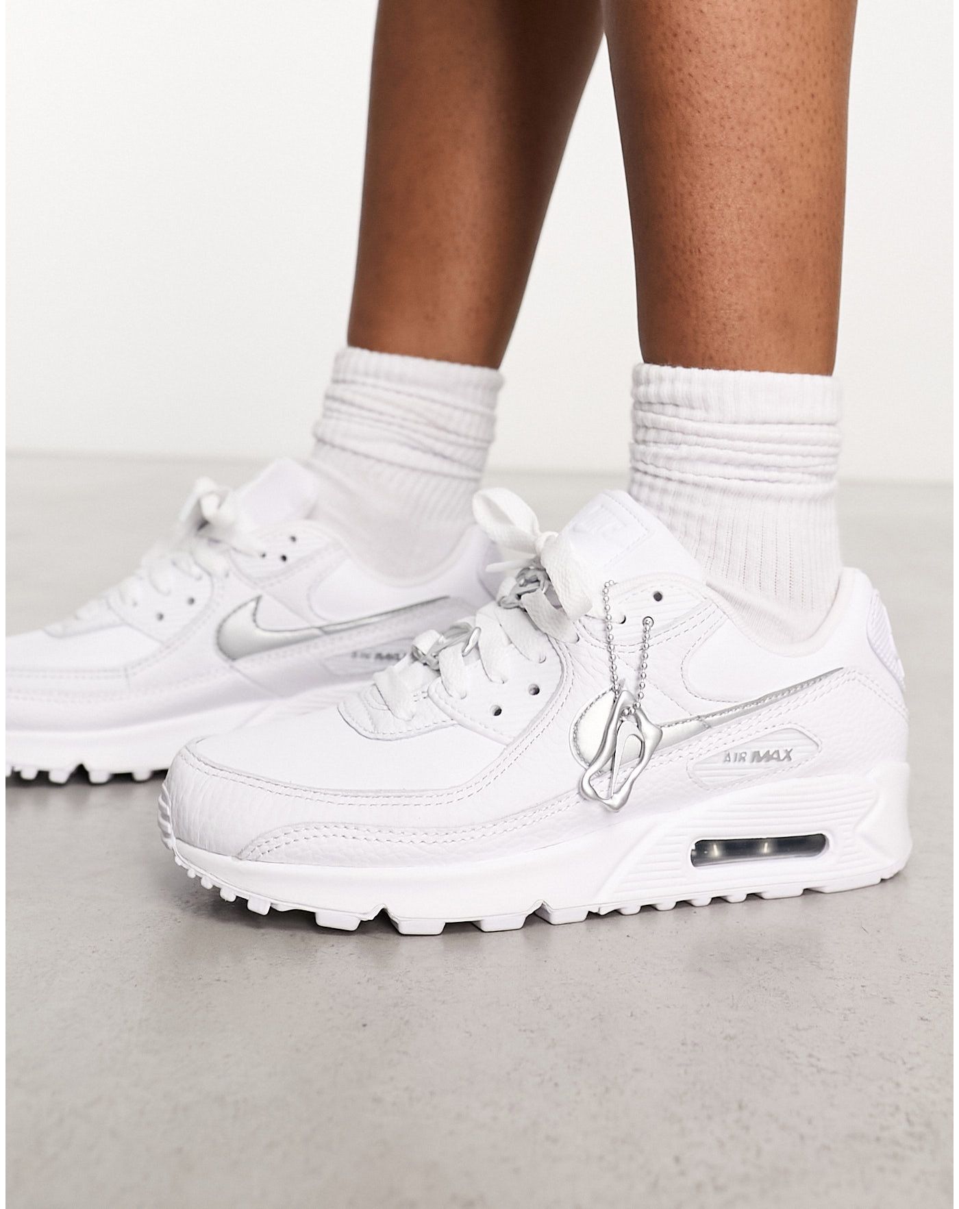 Nike Air Max 90 trainers in white and silver jewellery