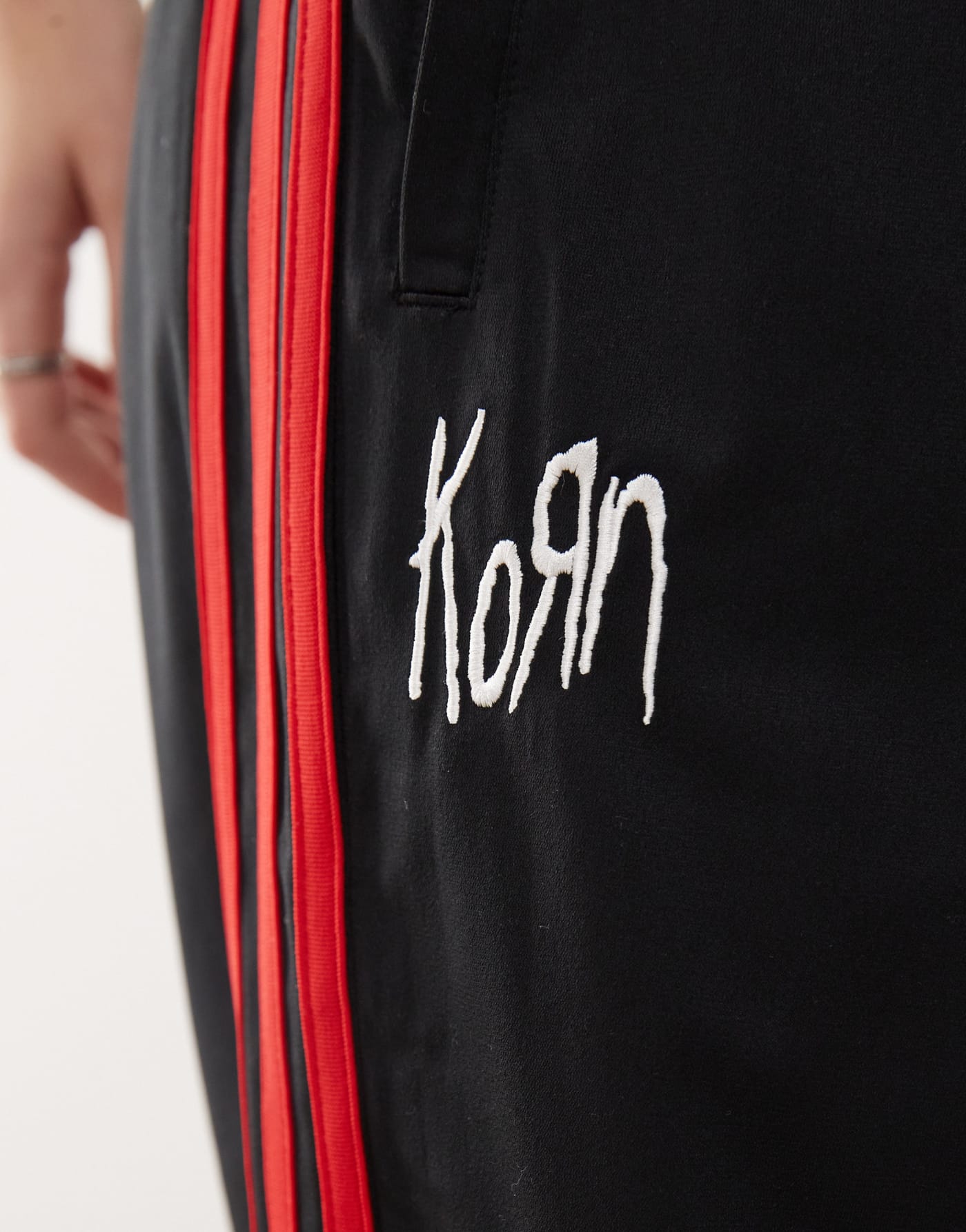 adidas Originals x KoRn reversible track bottoms in black, red and purple tartan