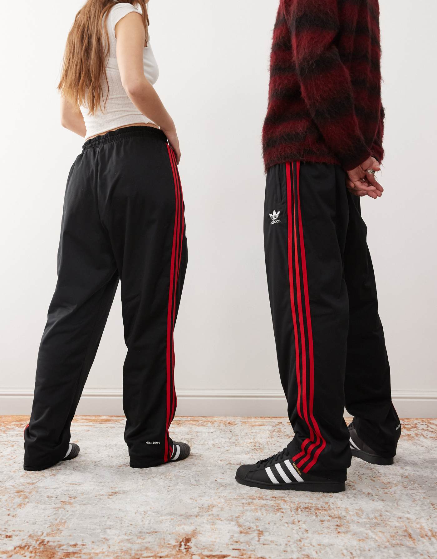 adidas Originals x KoRn reversible track bottoms in black, red and purple tartan