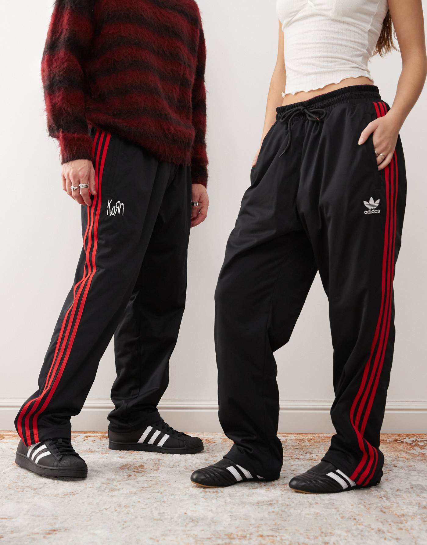 adidas Originals x KoRn reversible track bottoms in black, red and purple tartan