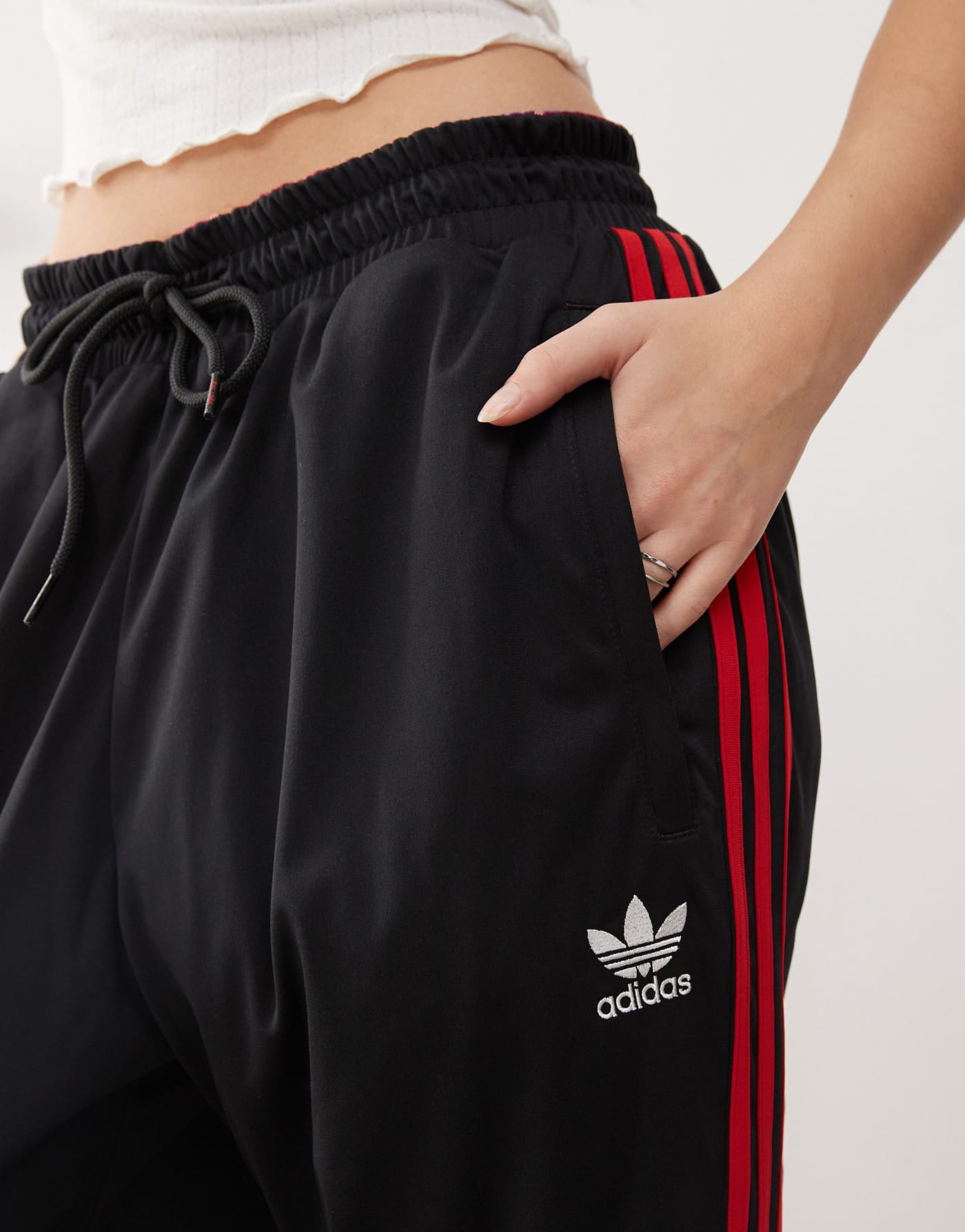 adidas Originals x KoRn reversible track bottoms in black, red and purple tartan