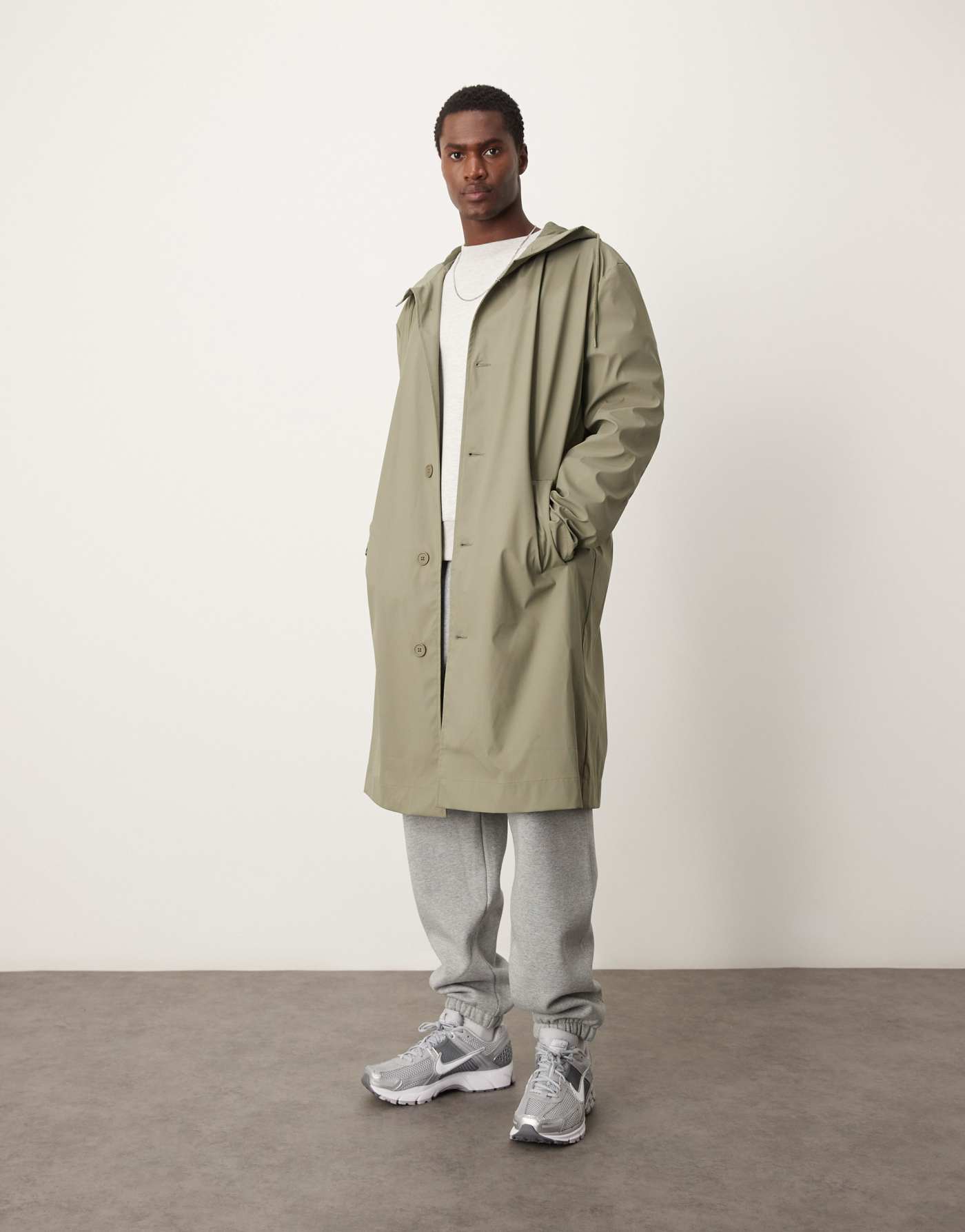 ASOS DESIGN rubberised trench coat with hood in khaki