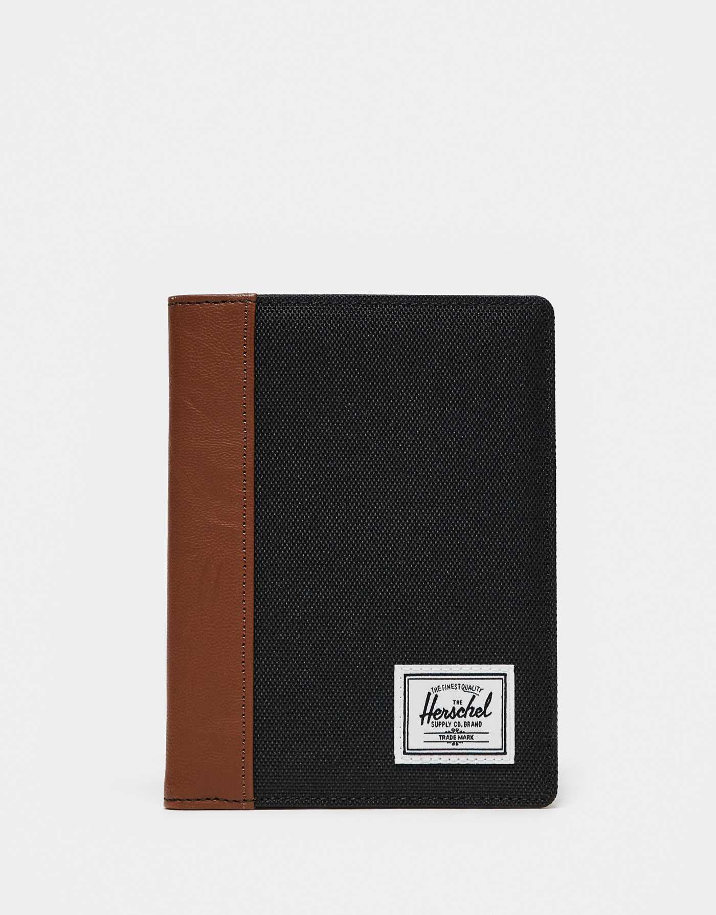 Herschel Supply Co raynor passport holder in black/tan