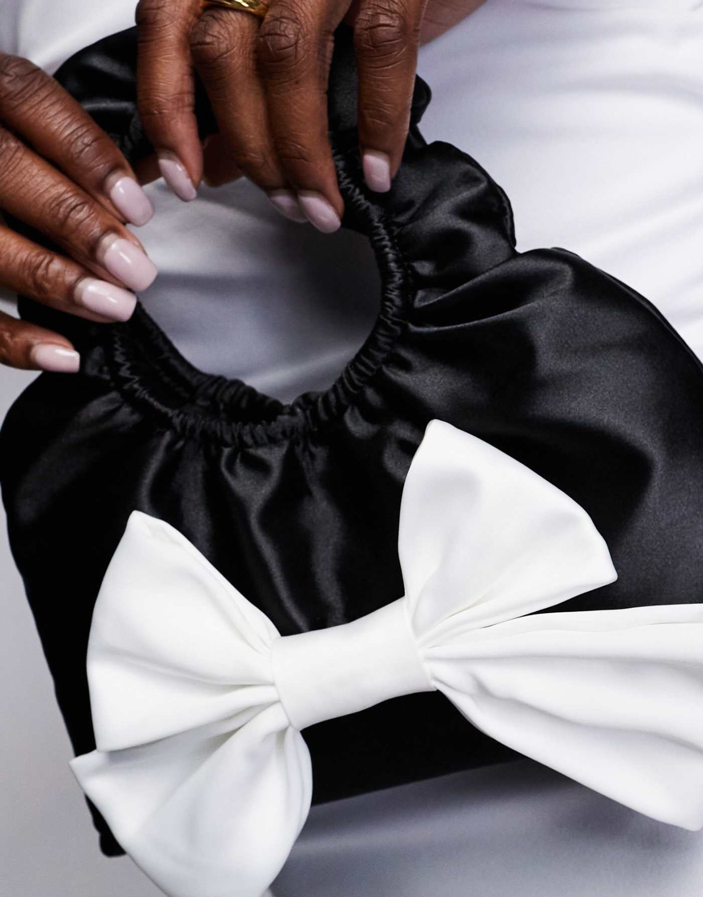 True Decadence bow front satin bag in black & white