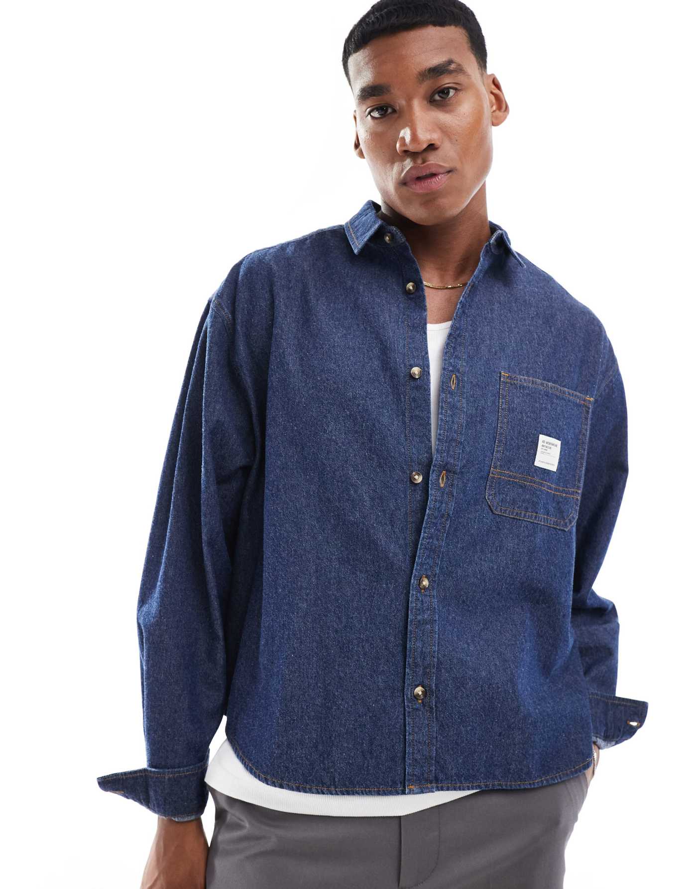 ASOS DESIGN boxy oversized denim shirt with badge detail in blue