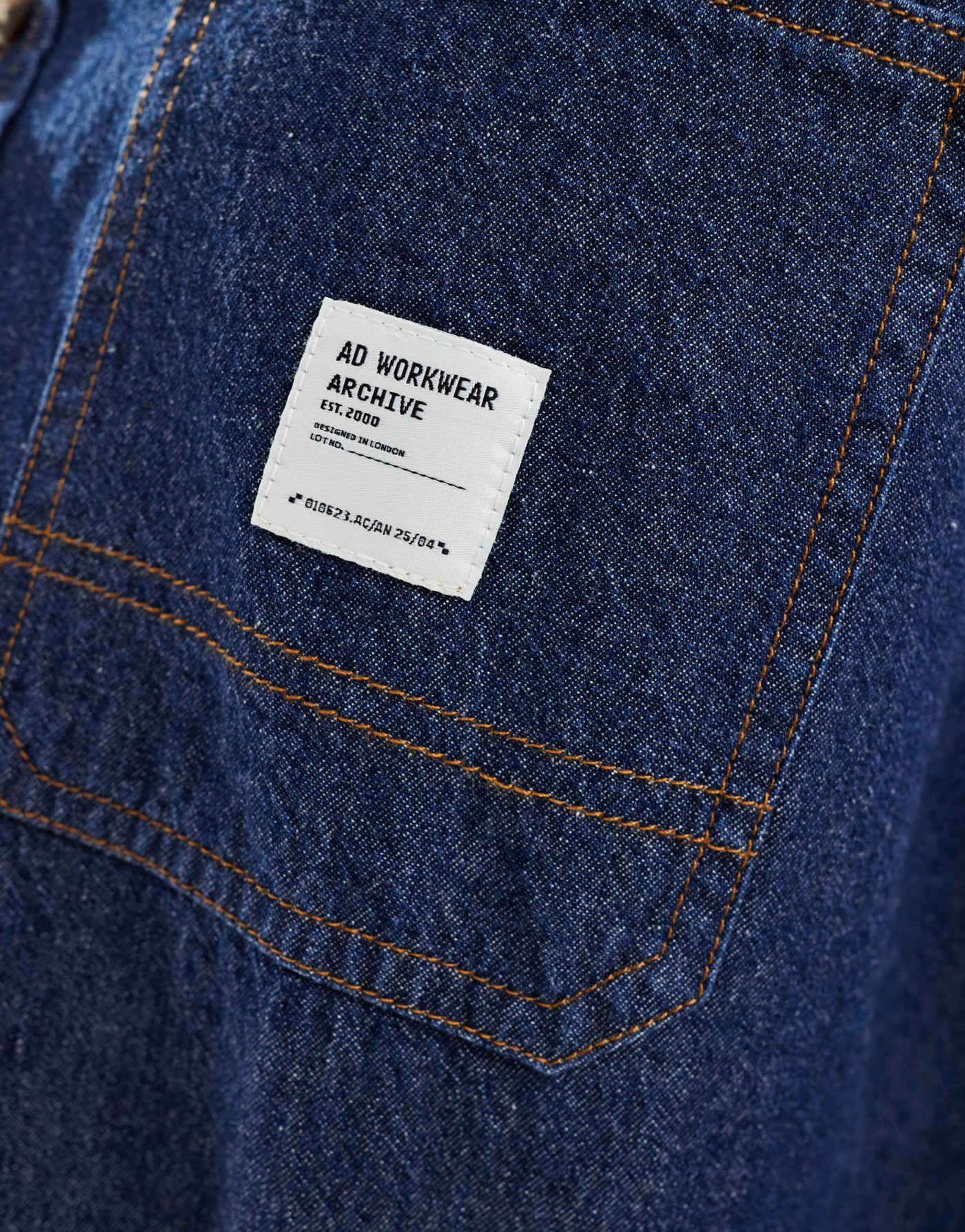 ASOS DESIGN boxy oversized denim shirt with badge detail in blue