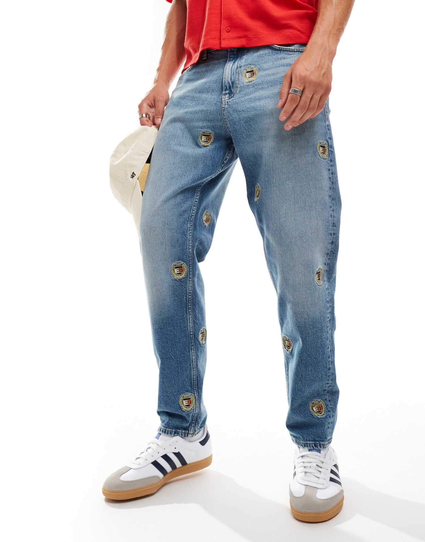 Tommy Jeans Isaac relaxed tapered jeans in mid wash with crest details