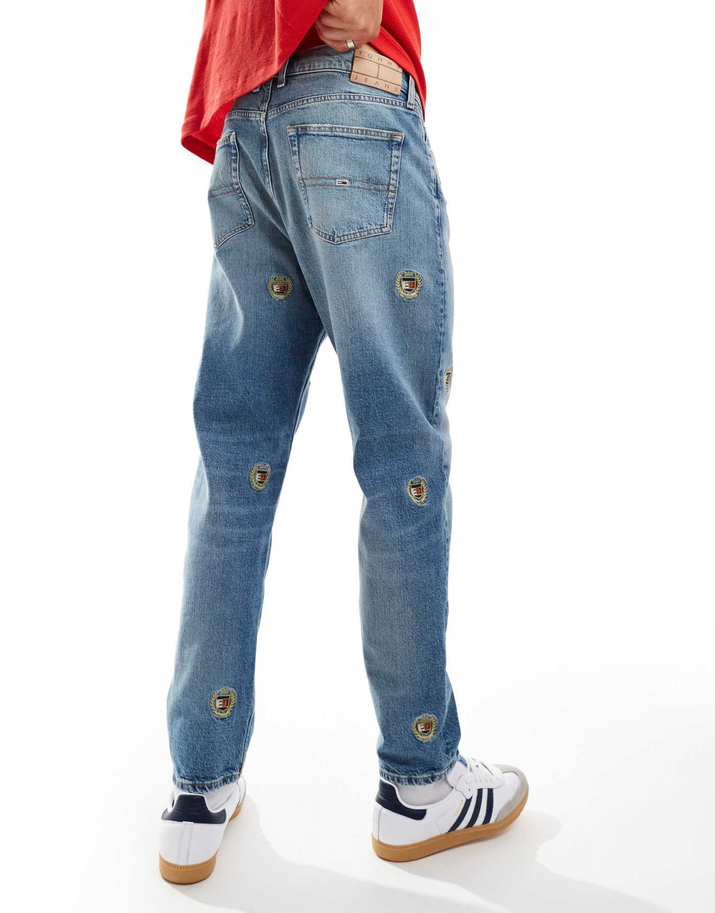 Tommy Jeans Isaac relaxed tapered jeans in mid wash with crest details