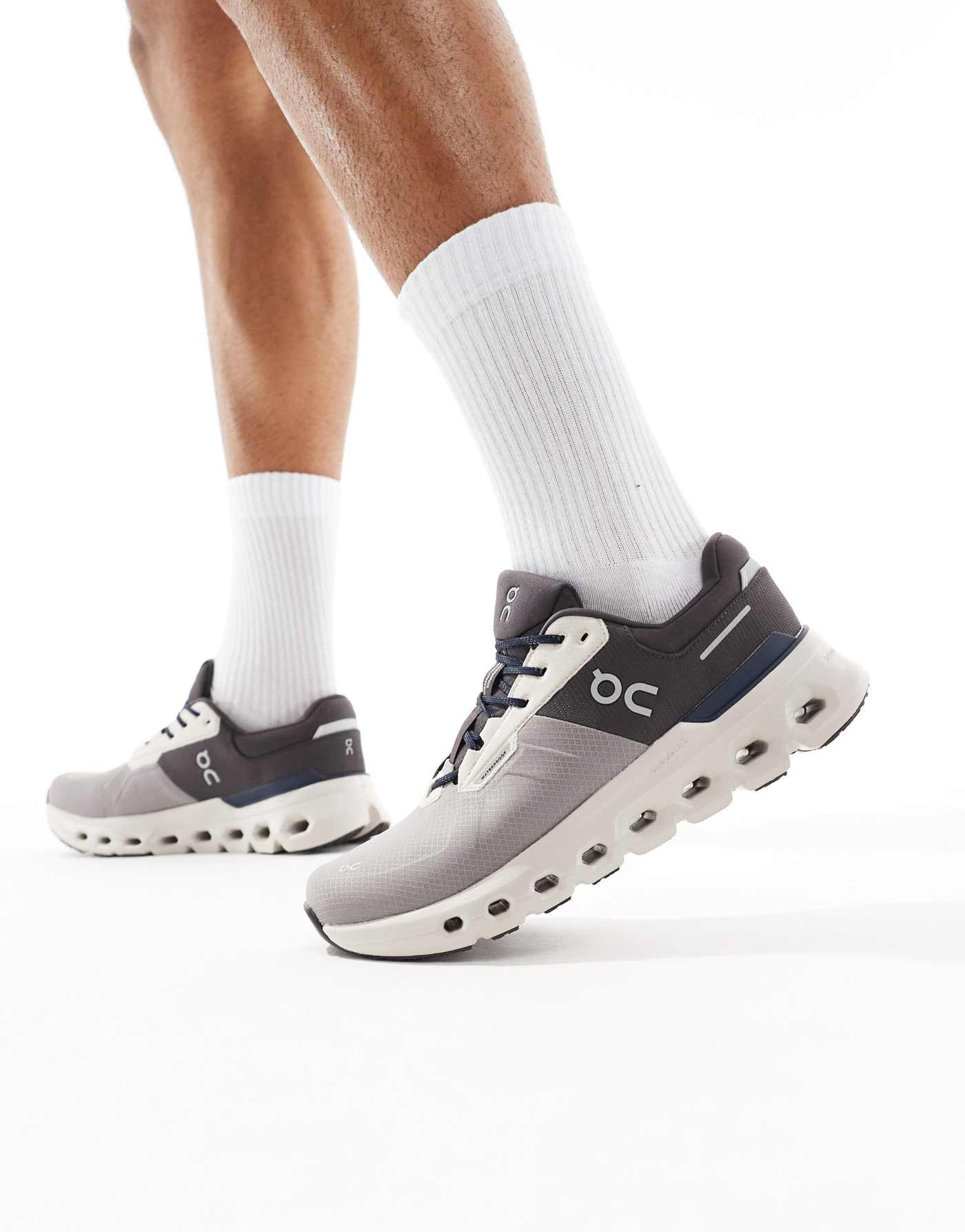 ON Cloudrunner 2 Waterproof running trainers in grey and navy