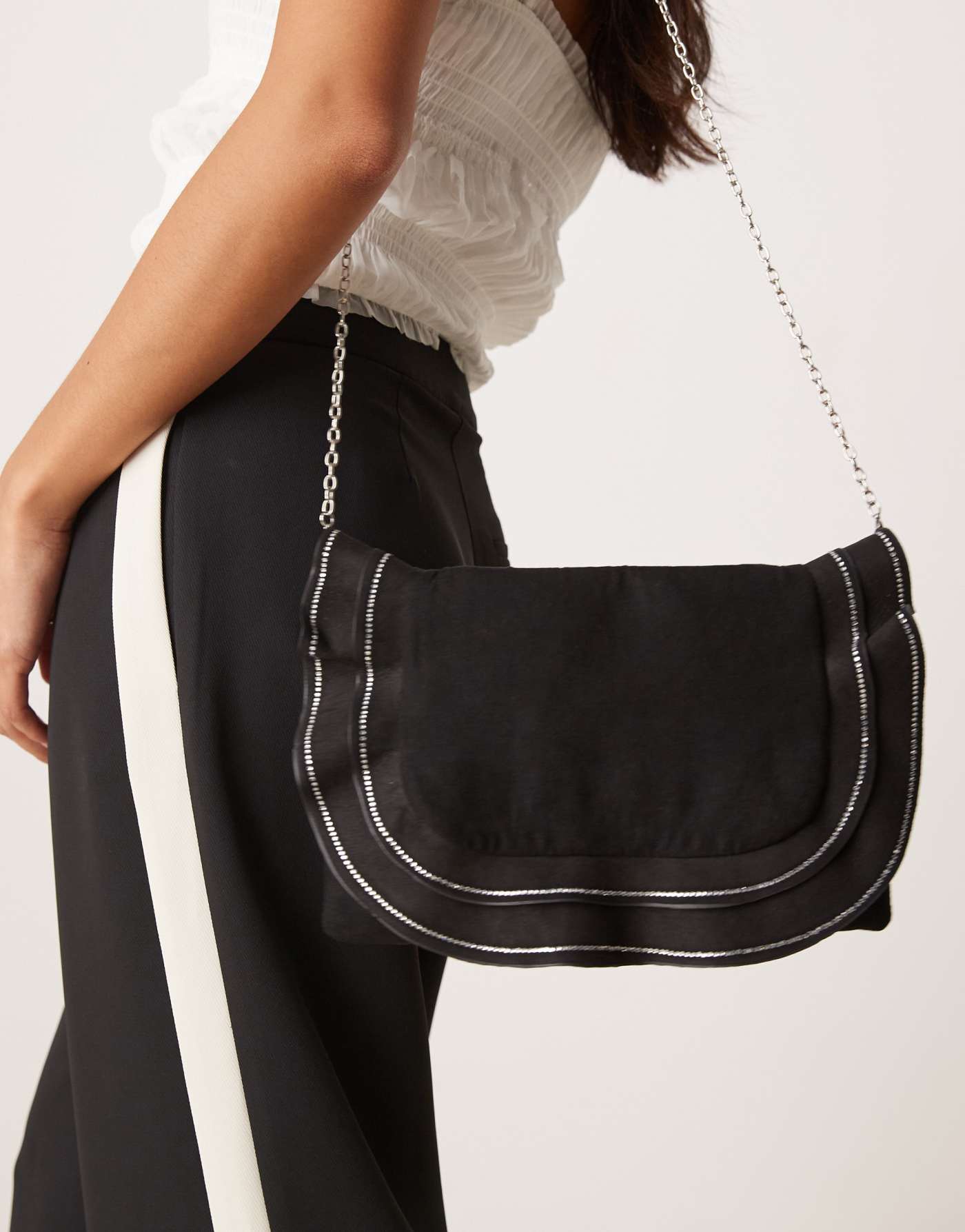 True Decadence ruffle clutch bag with diamante detail in black