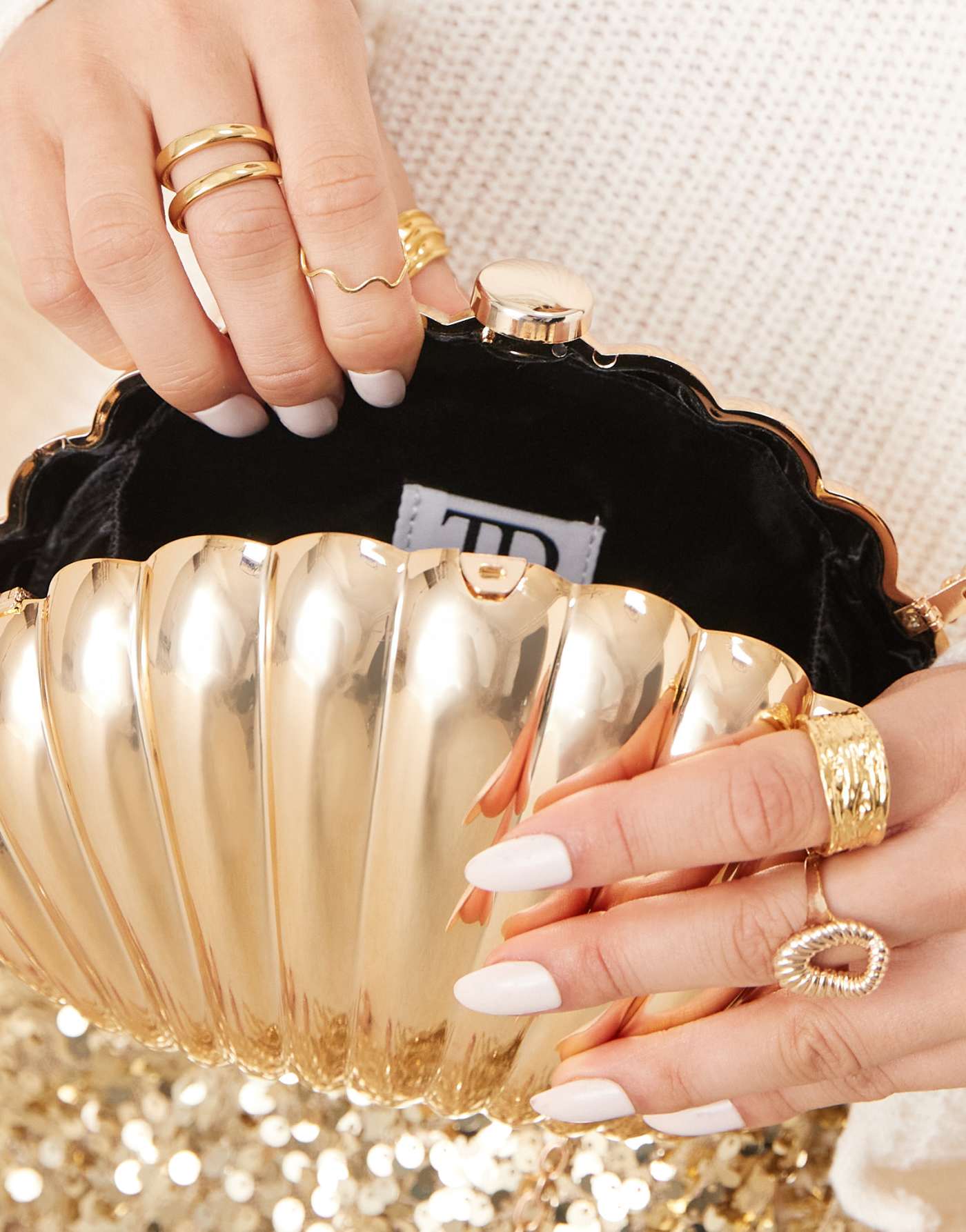 True Decadence shell clutch bag in gold