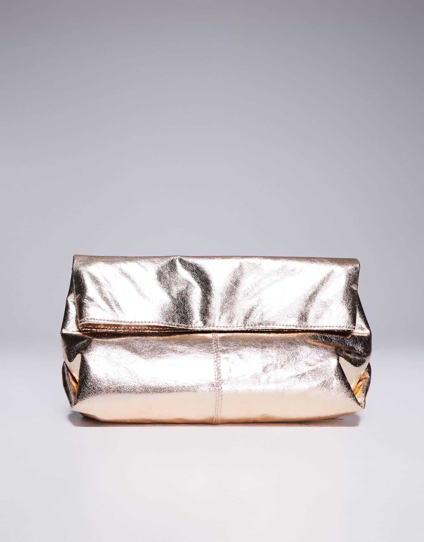 ASOS DESIGN fold over clutch bag in gold