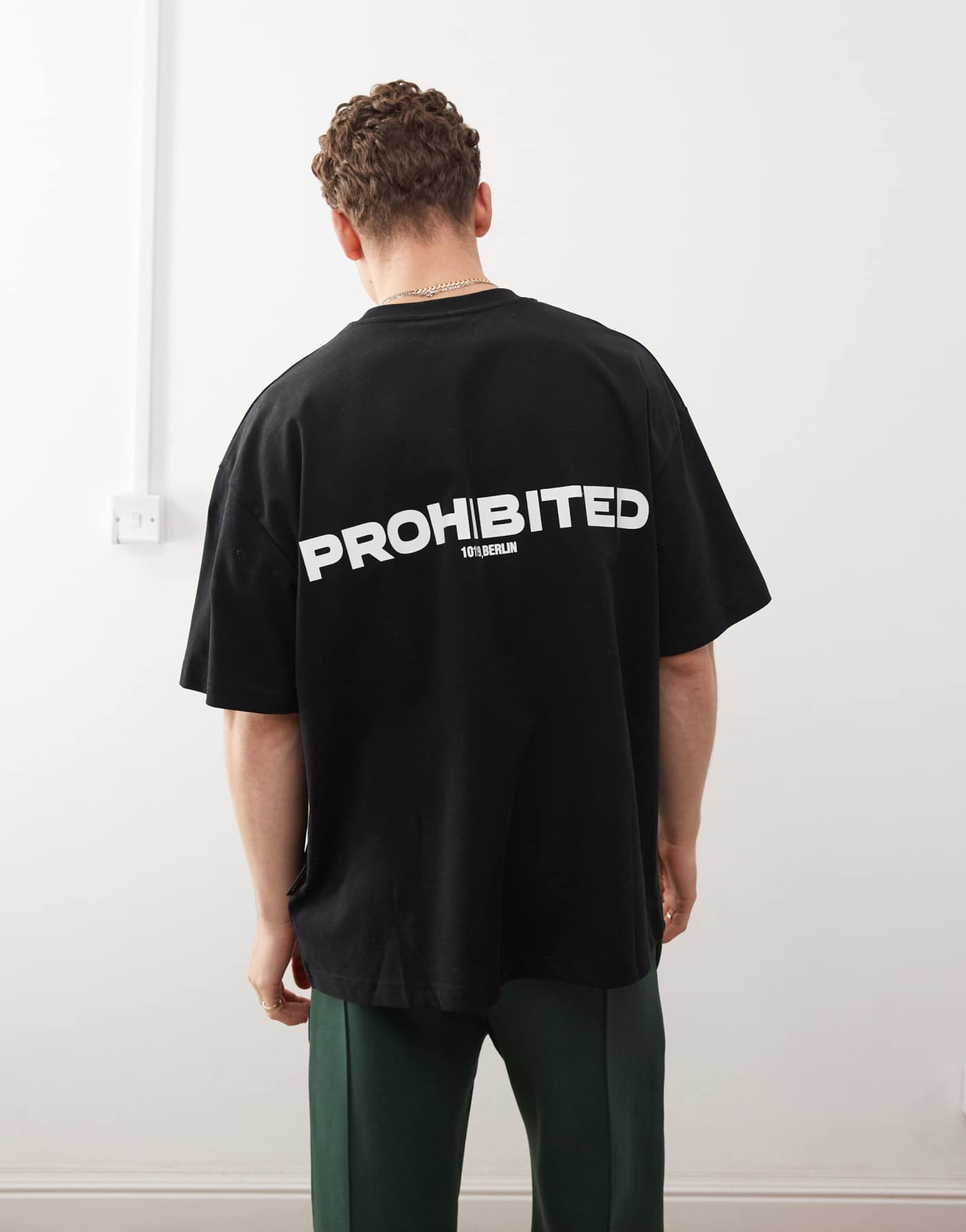 Prohibited script logo boxy t-shirt in black