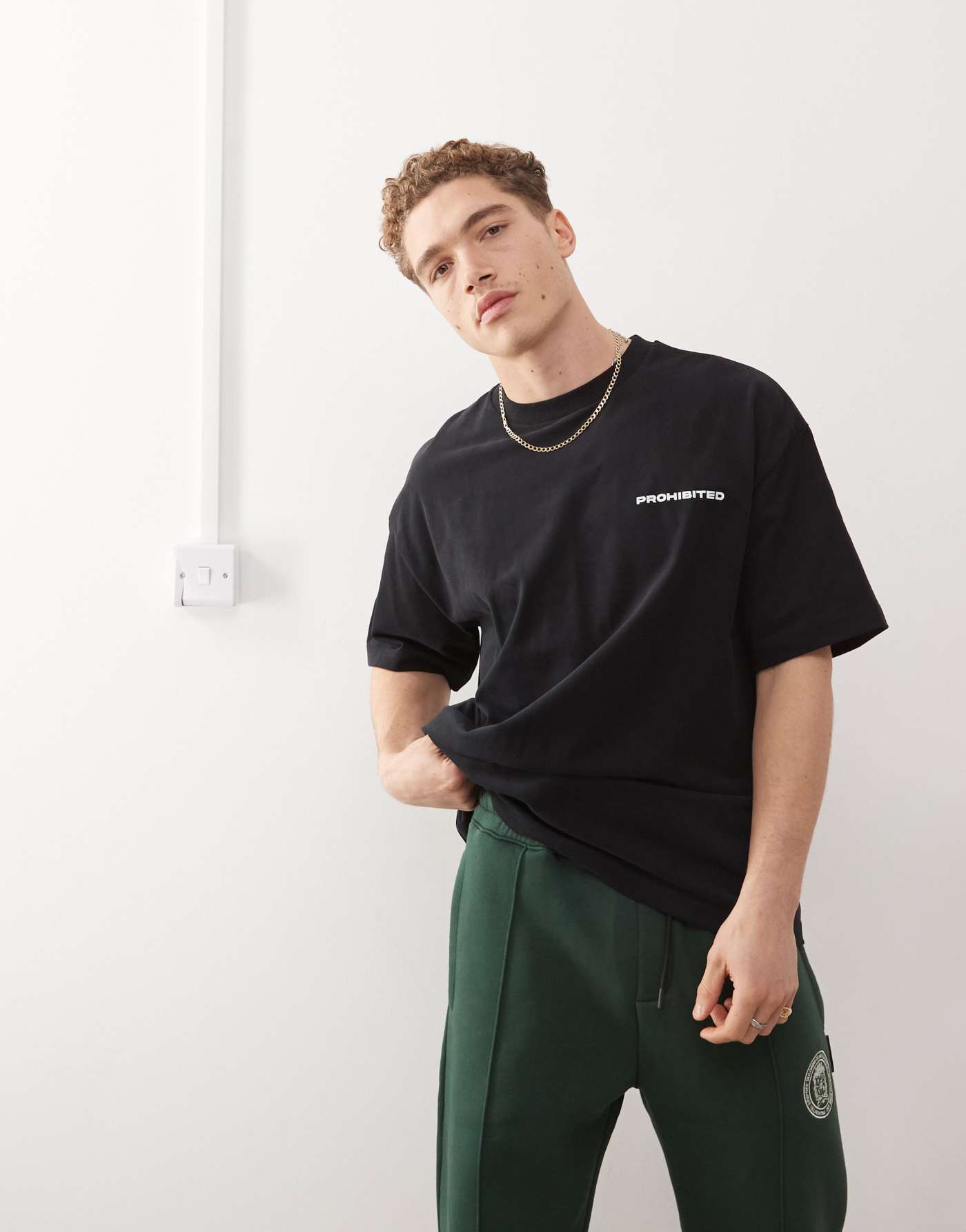 Prohibited script logo boxy t-shirt in black