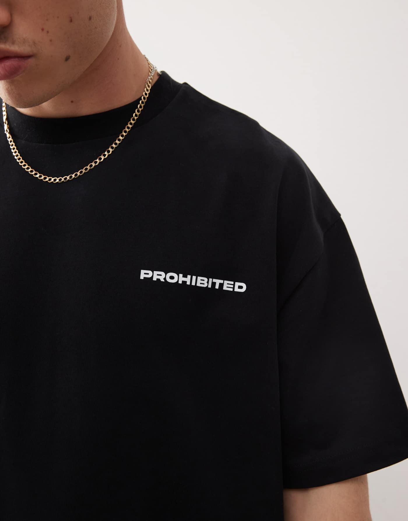 Prohibited script logo boxy t-shirt in black