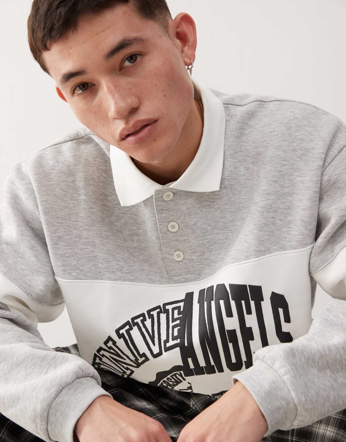 Weekday Andre oversized polo sweatshirt with cut and sew varsity graphic in grey melange