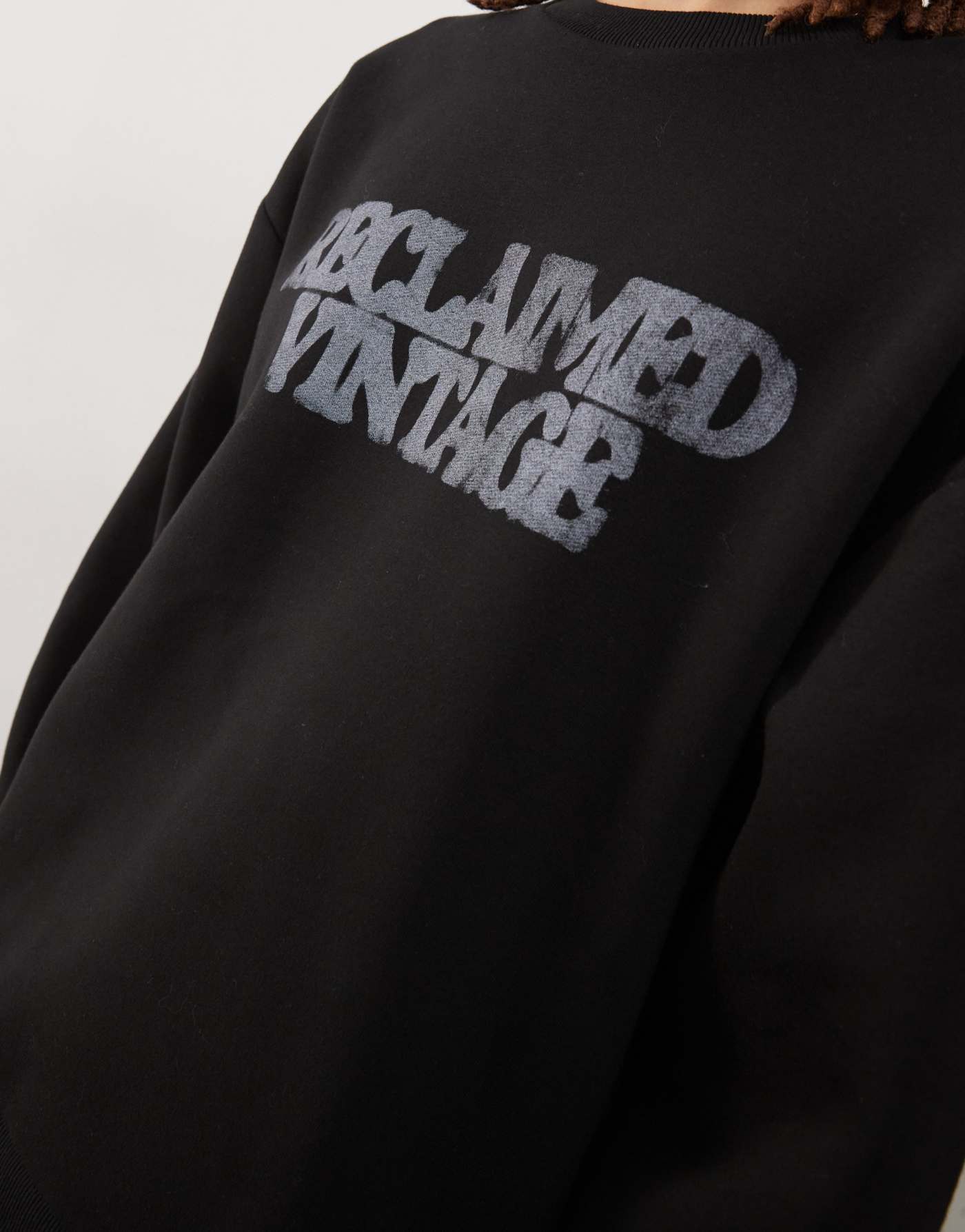 Reclaimed Vintage unisex oversized sweat in black with spray logo