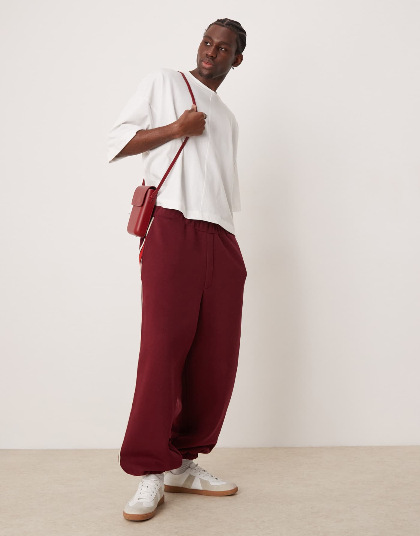 ASOS DESIGN oversized balloon jogger with taping in burgundy