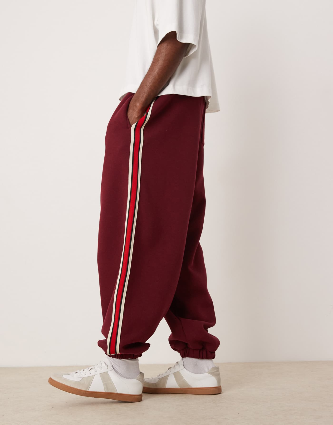 ASOS DESIGN oversized balloon jogger with taping in burgundy