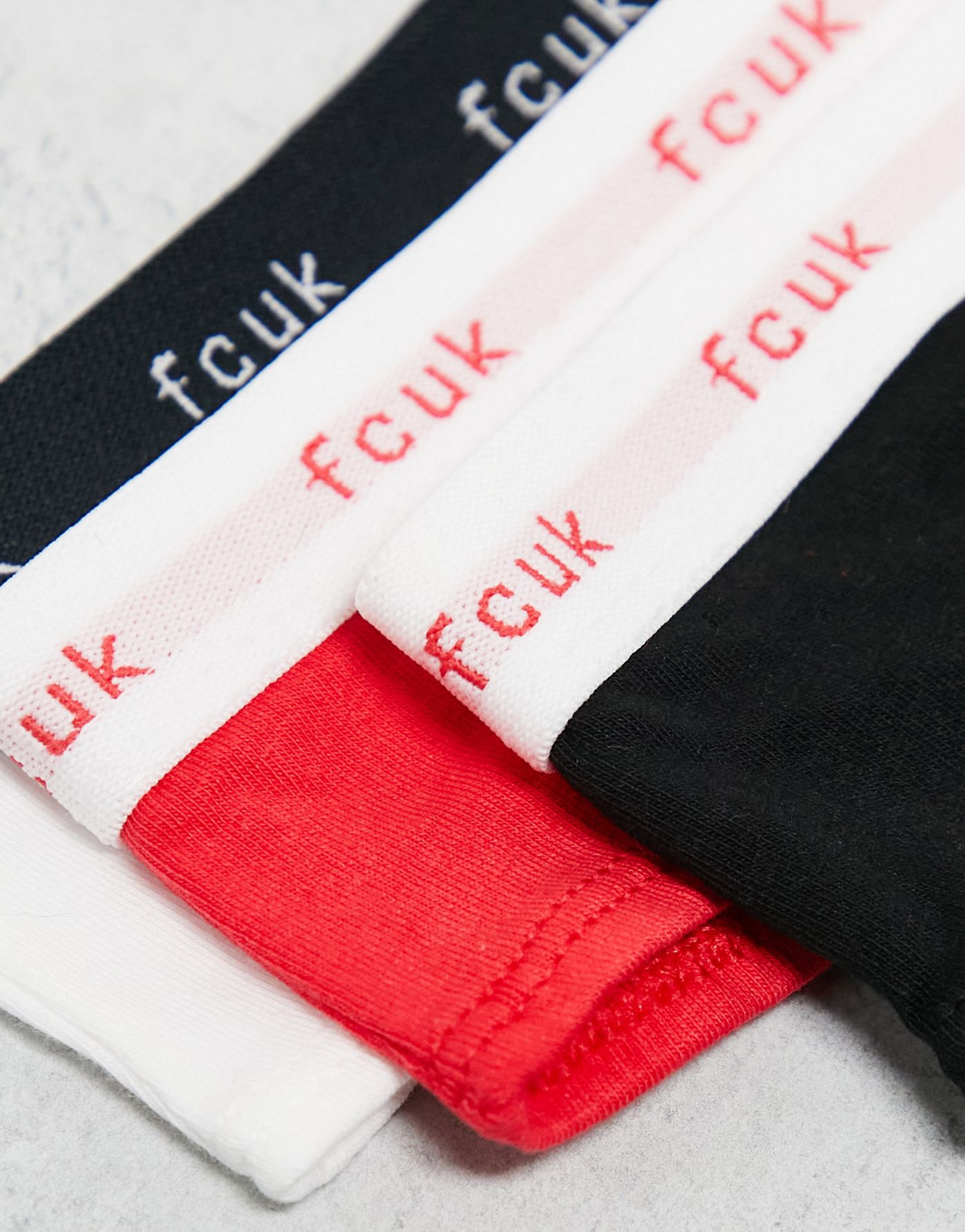 FCUK 3 pack thongs in black, white and hibiscus