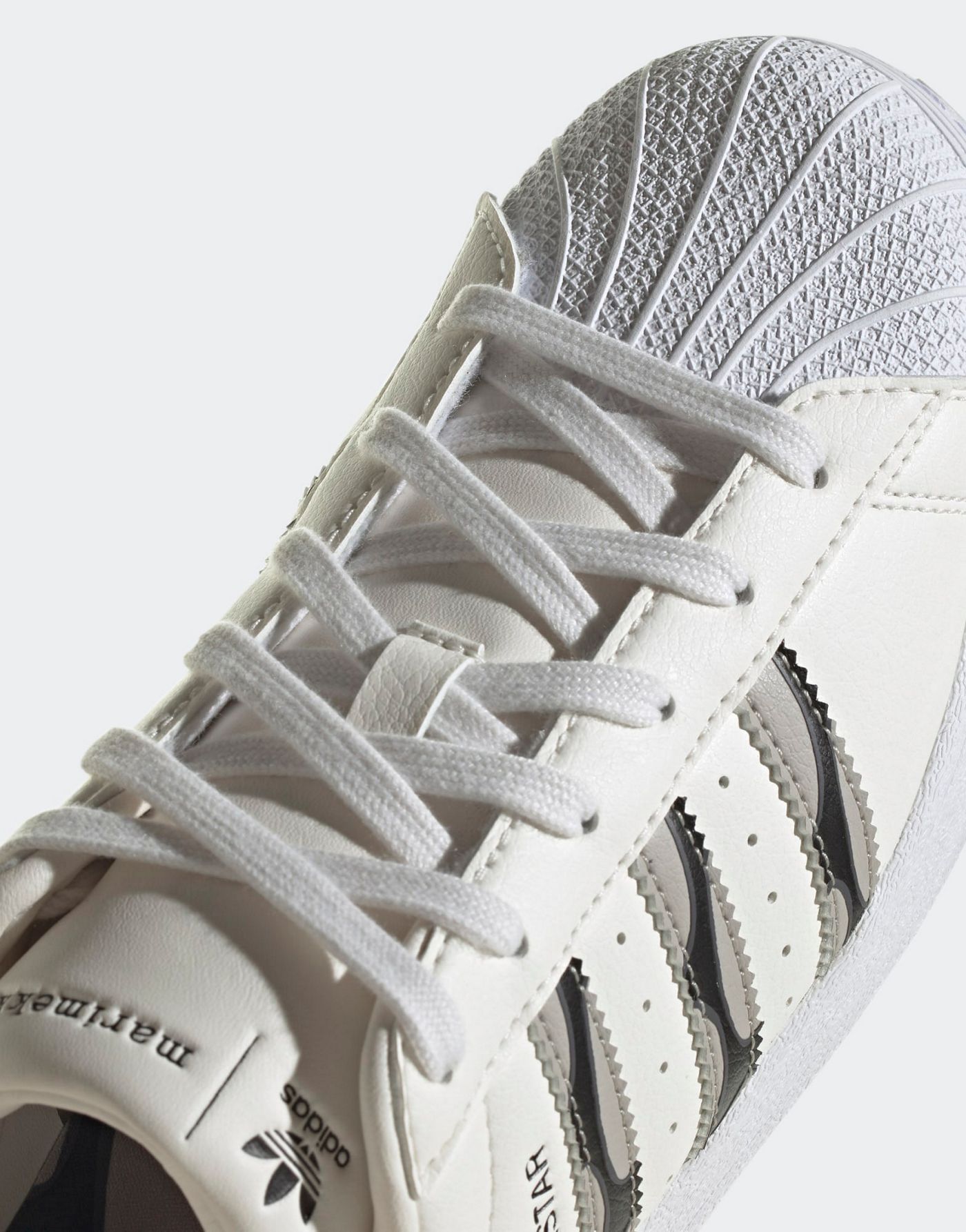 adidas Originals Superstar trainers in white and black