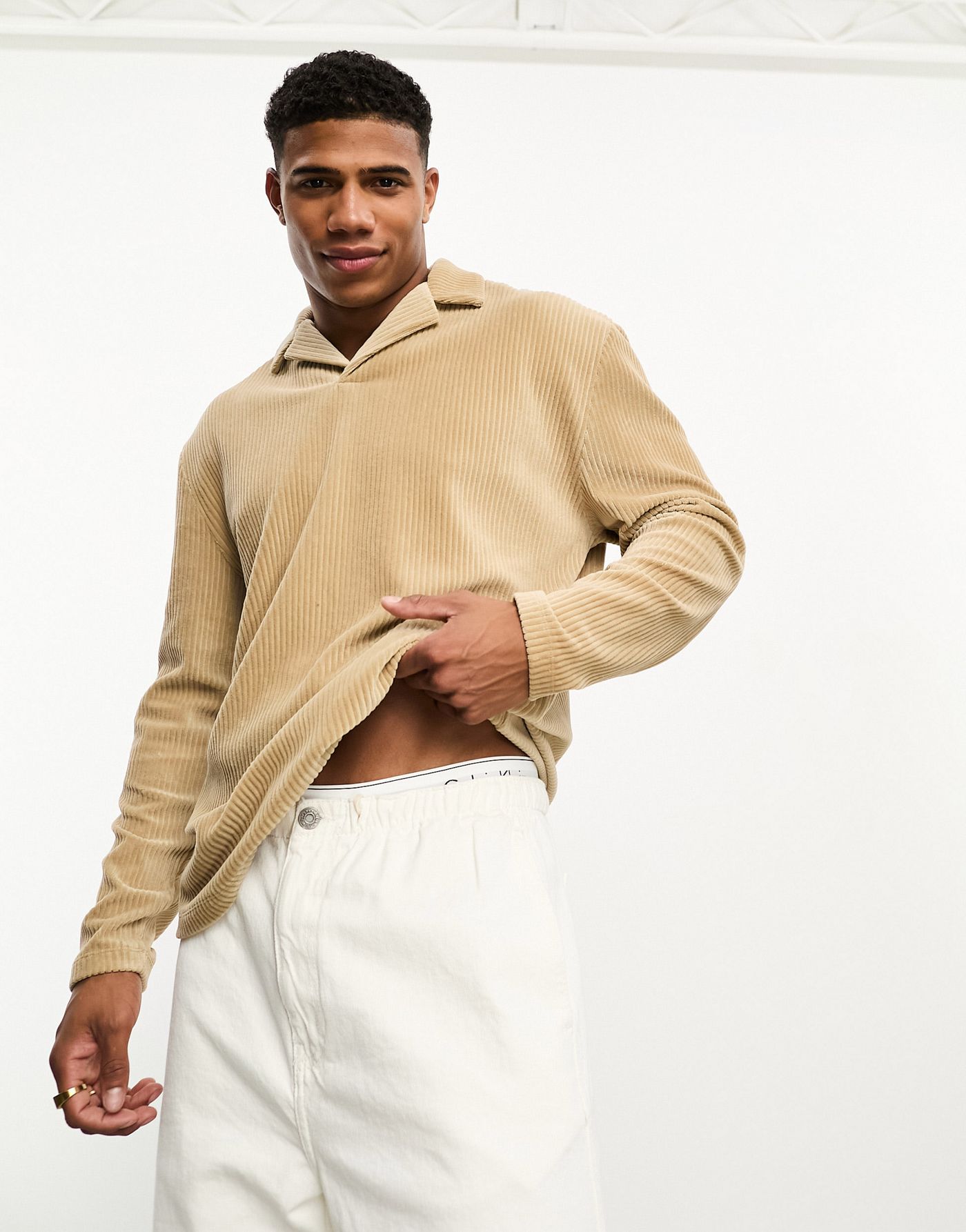 ASOS DESIGN relaxed long sleeve polo with revere collar in beige ribbed velour