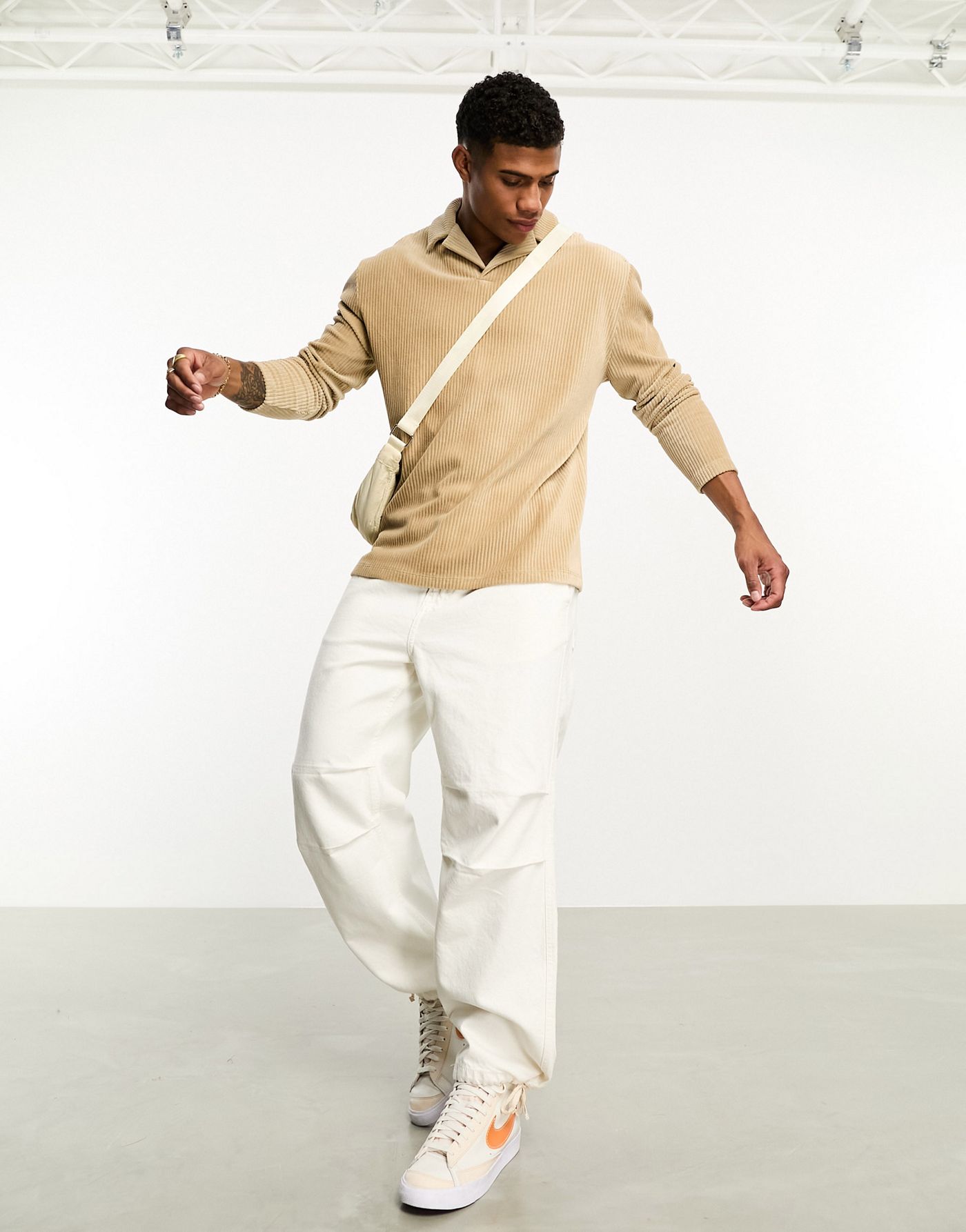 ASOS DESIGN relaxed long sleeve polo with revere collar in beige ribbed velour