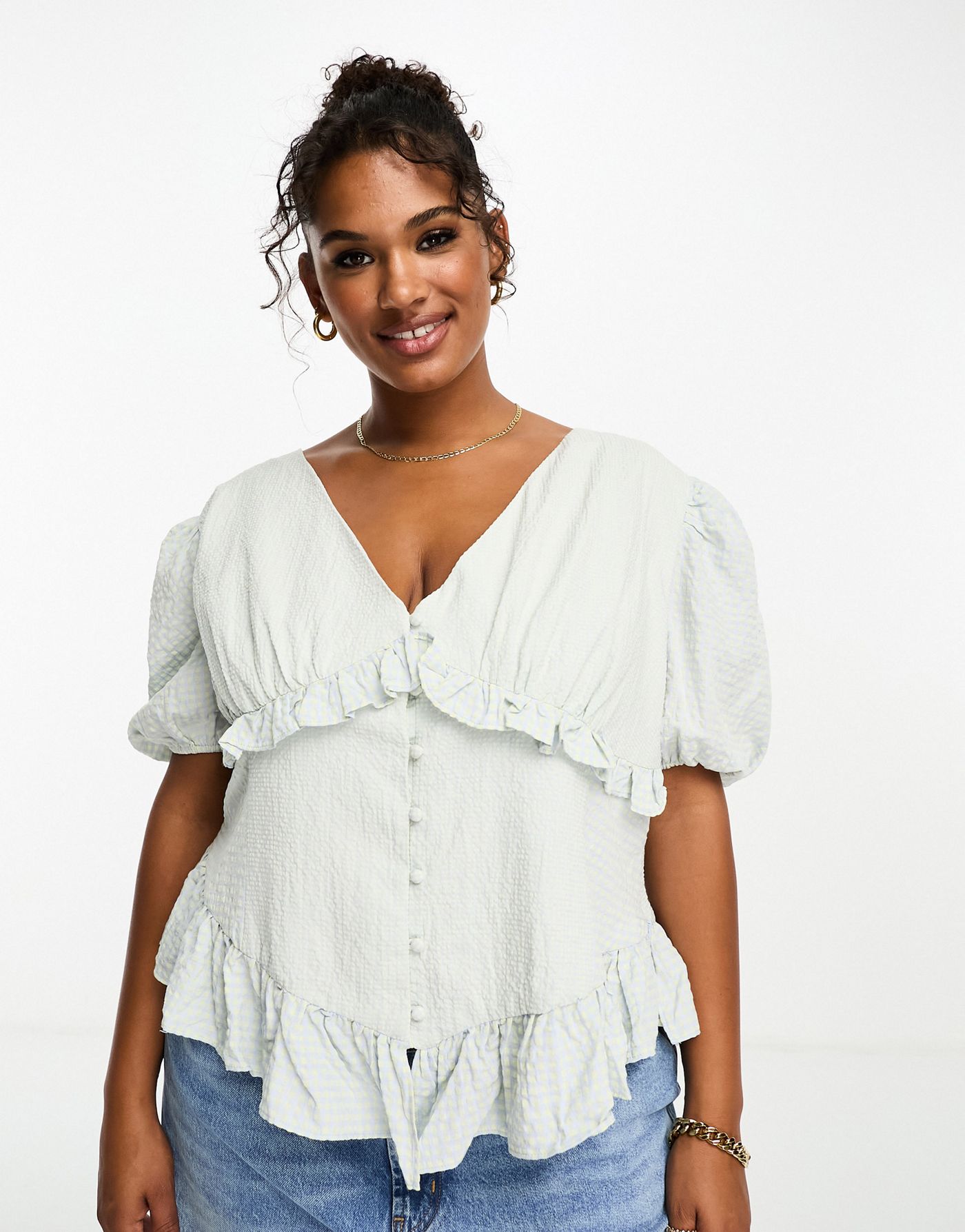 The Frolic Plus  v-neck button front puff sleeve blouse in blue gingham