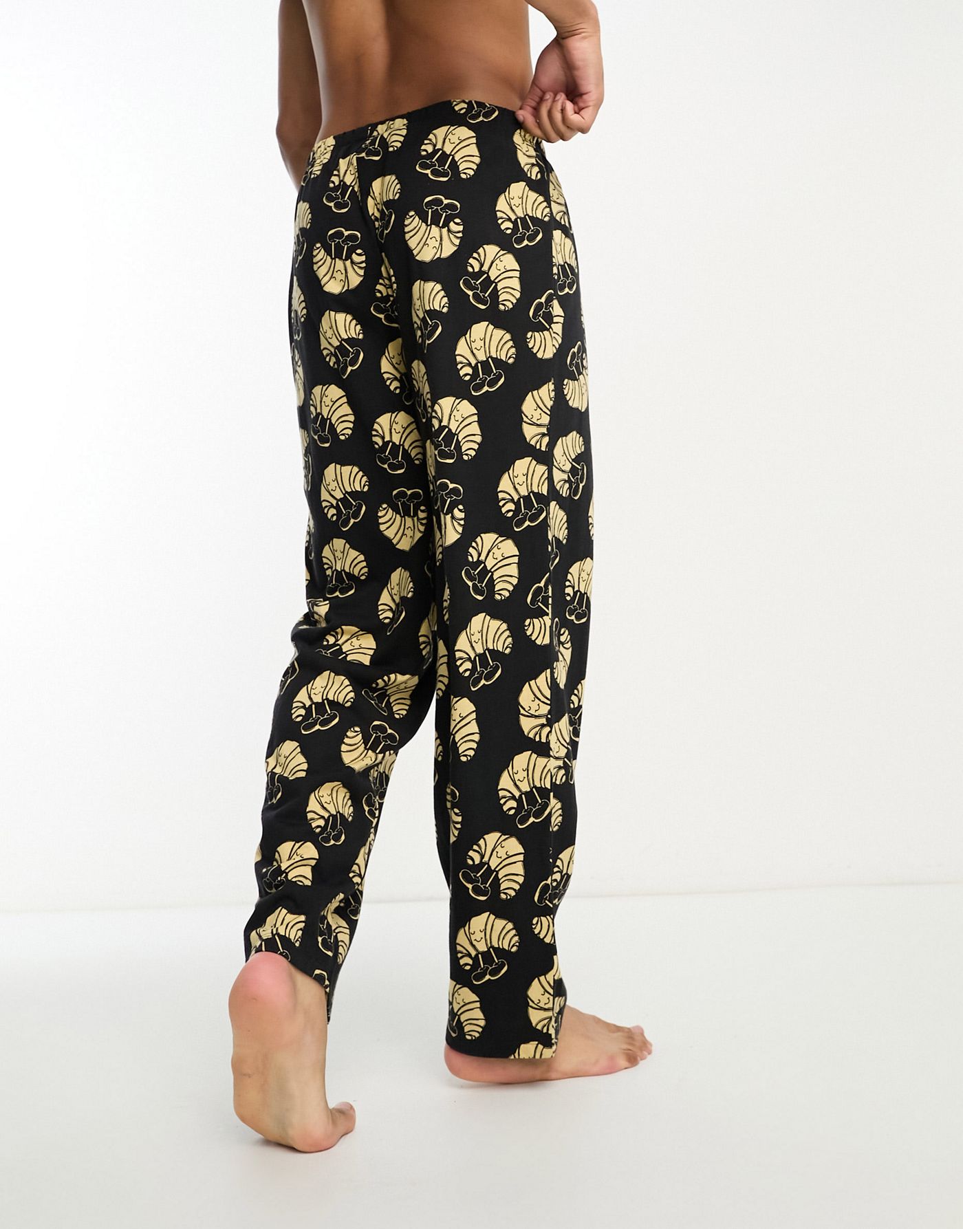 ASOS DESIGN lounge bottoms in black with croissant print