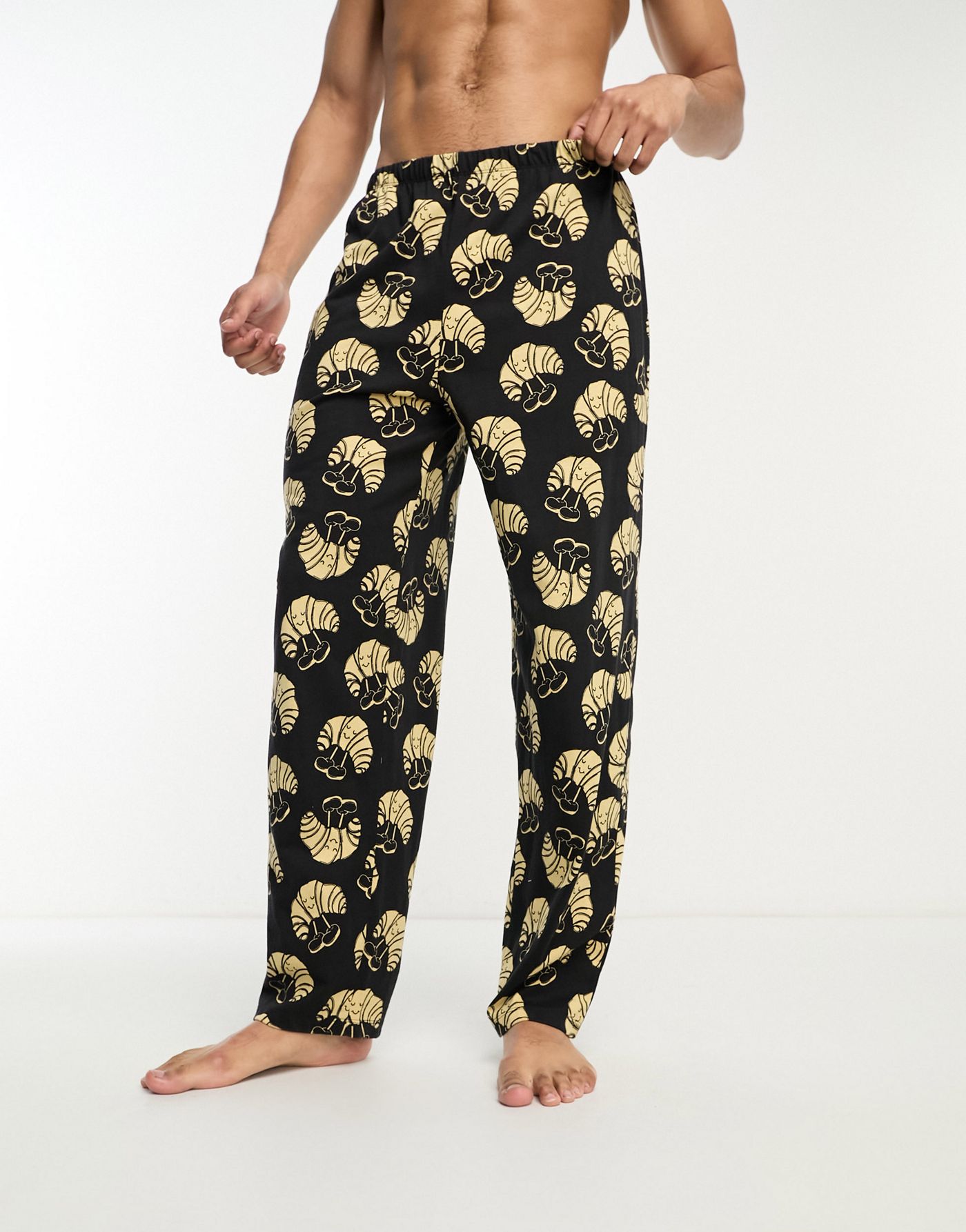 ASOS DESIGN lounge bottoms in black with croissant print