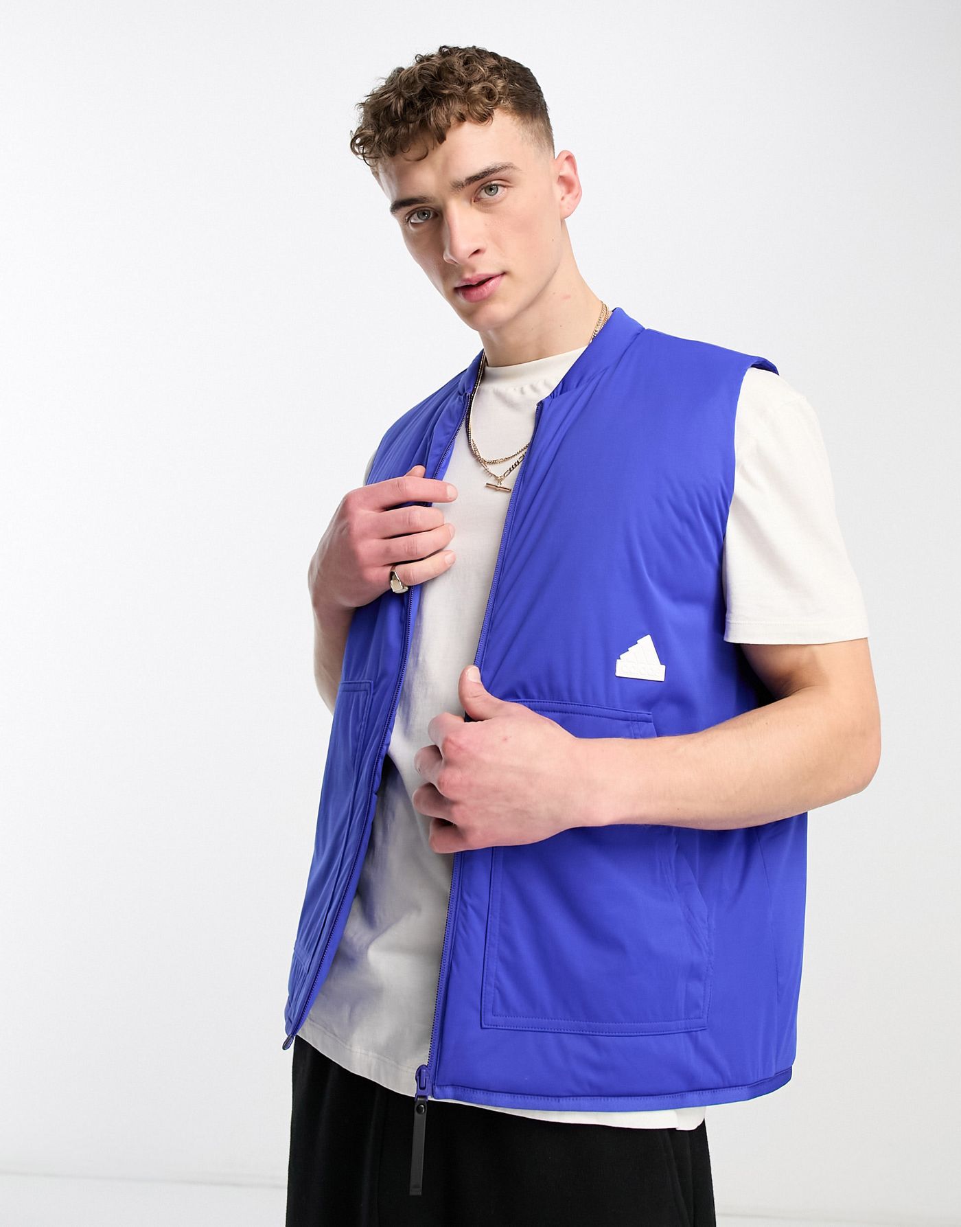 adidas Sportswear Future Lounge rubber logo puffer vest in blue