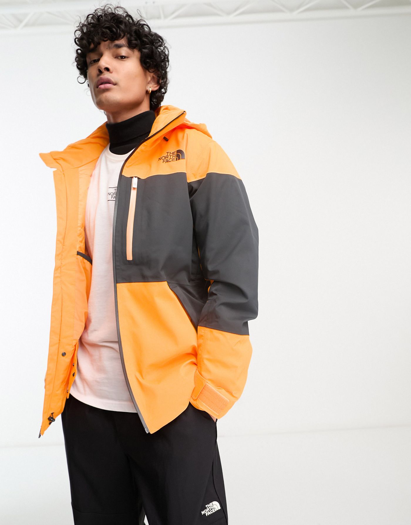 The North Face Ski Chakal insulated DryVent waterproof ski jacket in black and orange