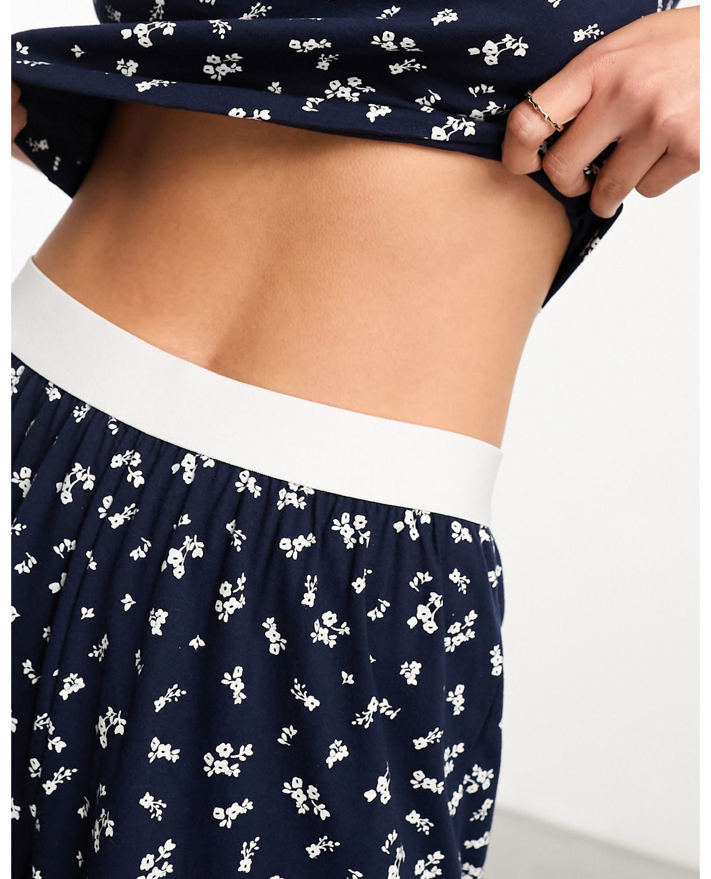 ASOS DESIGN mix & match ditsy print pyjama trouser with exposed waistband and picot trim in navy