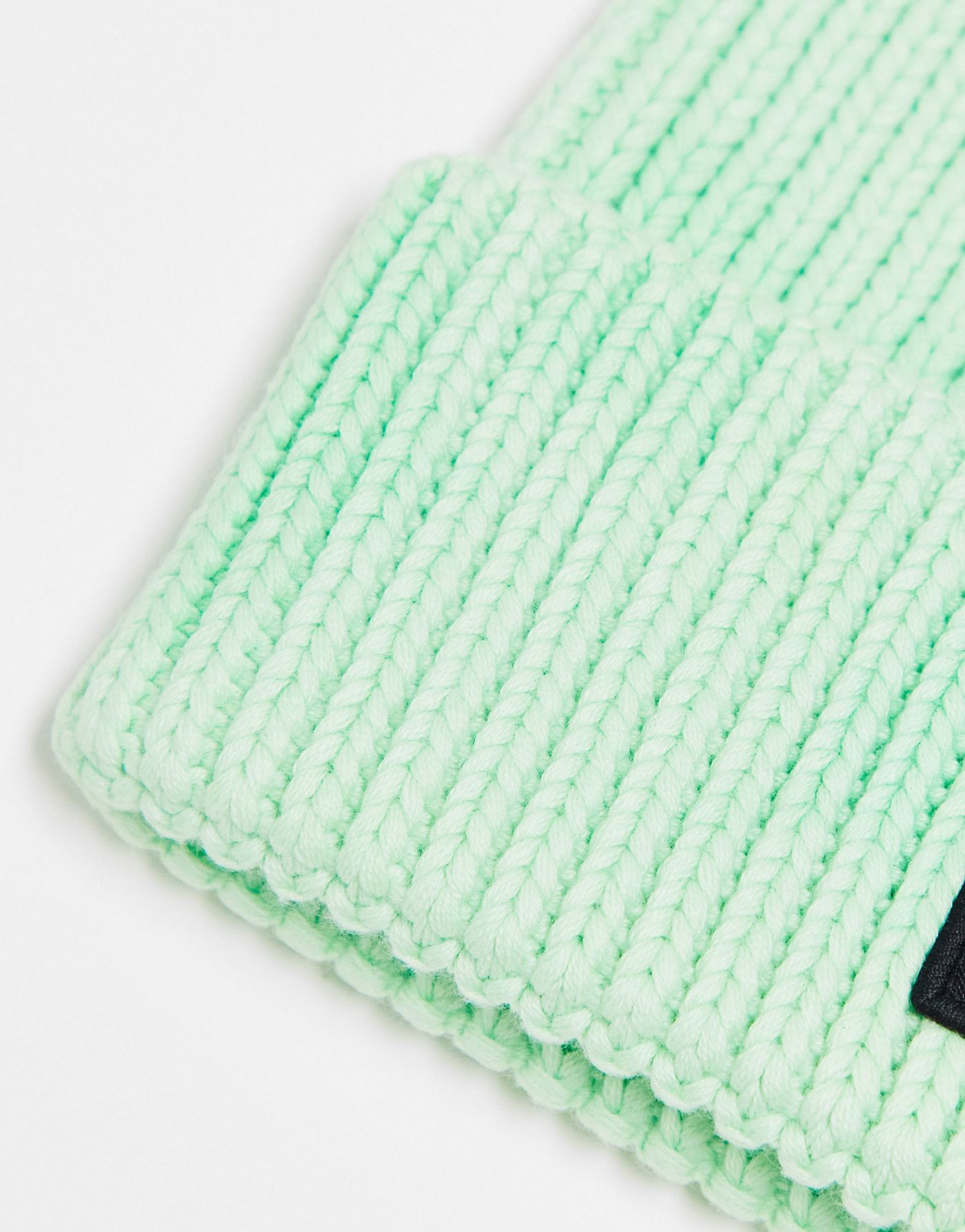 The North Face Logo patch cuffed beanie in green tie dye